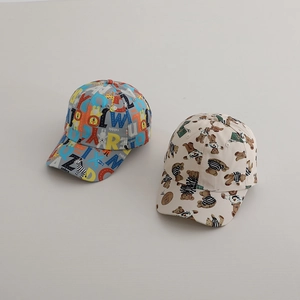 Detailed close-up of cute cartoon animals and teddy bear prints on cotton baseball caps