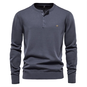 Men's dark blue long sleeve Henley knit sweater with ribbed cuffs and button neckline