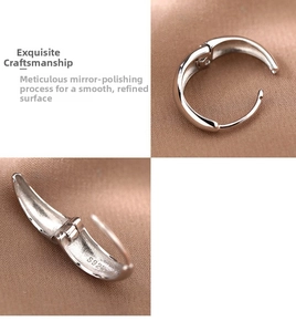 Detailed macro view of S925 sterling silver hoop earrings with mirror polished finish