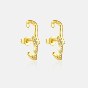 Macro detail of S925 sterling silver stamp on gold plated zircon earrings back