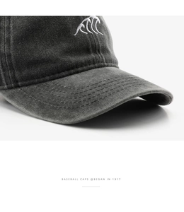 Close-up of vintage dark grey washed cotton baseball cap with white wave embroidery details