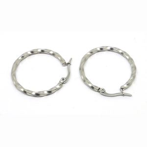 Polished silver twisted hoop earrings made of stainless steel with a sleek hinge closure