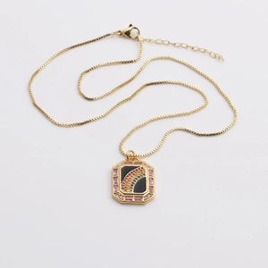 Detailed close-up of rainbow zircon rectangle pendant on a gold box chain necklace