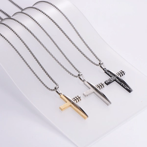 Hip hop stainless steel cross necklaces in gold, silver, and black colors on display