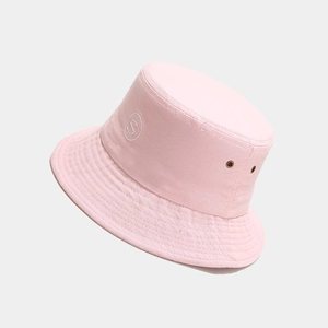 Detail view of pink cotton bucket hat showing S logo embroidery and metal eyelets