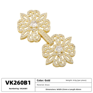 Macro detail of brass flower clasp with white zircon stones for jewelry necklaces