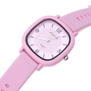 Pink square dial ladies watch with soft silicone strap and quartz movement on white background