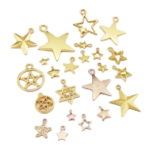 Assorted gold and rose gold star charms for DIY jewelry making displayed on white background