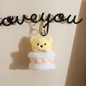 Cute plush bear cake keychain with soft fur, gold lobster clasp and purple good tag