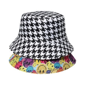 Reversible bucket hat with houndstooth pattern and colorful smiley face print for women