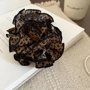 Leopard print double-layered lace hair claw clip styled with accessories