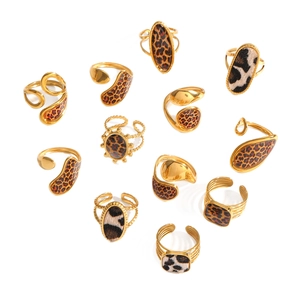 Golden stainless steel ring set with leopard and cow print geometric enamel designs