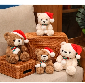 Detailed close-up of soft curly plush texture on Christmas teddy bears with scarves