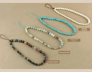 Close-up of beaded wrist straps in turquoise, amazonite, and indian agate stones