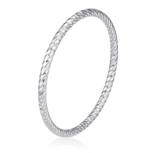Macro detail of silver stainless steel bangle featuring twisted rope texture and polished finish