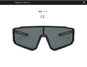 Close-up of matte black cycling goggles featuring wide dark gray lenses and air flow vents