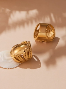 Detail of wide hollow 18k gold plated stainless steel rings with bead accents and shells
