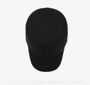 Top down view of black wool military cap for men with detailed metal logo and warm texture