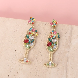 Detailed close-up of gold cocktail glass earrings with colorful sparkling rhinestones