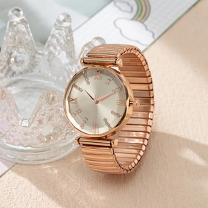 Detail of rose gold ladies quartz watch with Roman numerals and elastic metal strap