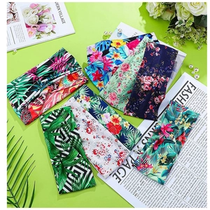 Flat lay of colorful Bohemian yoga headbands with tropical floral and striped patterns