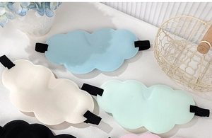 Detailed view of 3D cloud sleep masks in multiple colors on a comfortable display