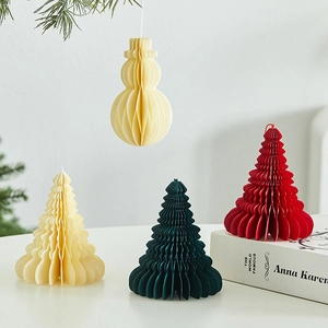 Set of honeycomb paper Christmas tree and snowman decorations for holiday window display