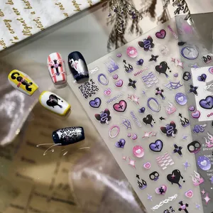 Y2K style jelly nail stickers with leopard print, butterflies and cross motifs in purple