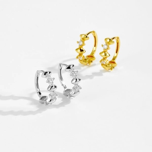 Detailed view of 925 sterling silver rhombus earrings in gold and silver finish with studs