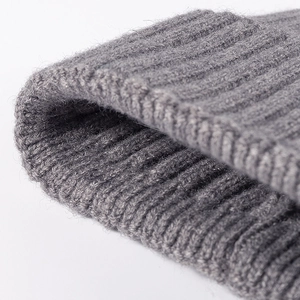 Gray ribbed knit beanie for women featuring premium wool blend texture and warm winter style