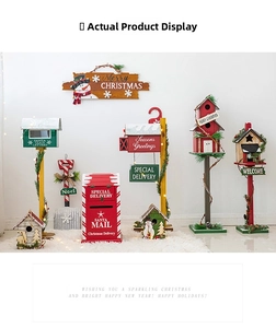 Macro view of Christmas wooden mailboxes and birdhouses with Santa Mail and Noel prints