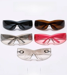 Close-up of five colorful oversized cycling sunglasses with metallic logo temple detail