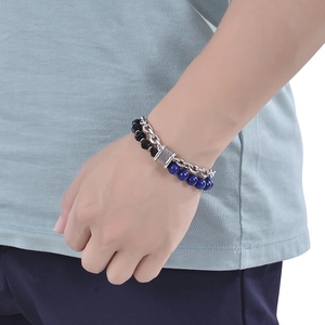 Detail view of double-layer stainless steel bracelet with blue lapis and black stones