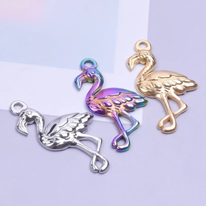 Three flamingo bird charms in gold, silver, and rainbow steel for DIY jewelry