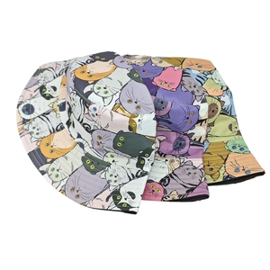 Detailed view of three stackable colorful cartoon cat print bucket hats for sun protection