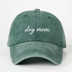 Close-up of vintage washed green cotton baseball cap with white dog mom embroidery
