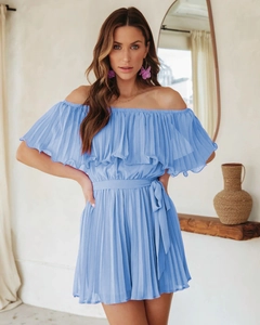 Detail of sky blue pleated off-shoulder romper featuring layered ruffles and waist tie belt