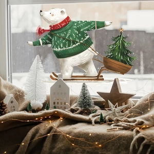 Christmas polar bear window cling decal with festive sweater and skiing scene