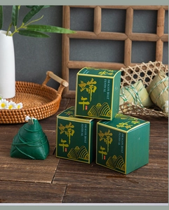 Detail of green zongzi-shaped scented candle in Dragon Boat Festival gift set box