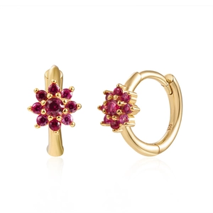 Detailed macro view of 925 silver flower earrings with purple zircons and 18K gold finish