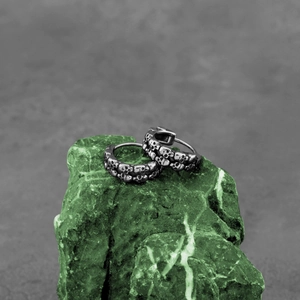 Punk style skull relief huggie hoop earrings in vintage silver stainless steel