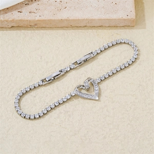 Detail of adjustable heart tennis bracelet featuring white cubic zirconia and silver plating