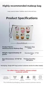 Detailed view of white linen cosmetic bag with cat cartoon print and 17x25cm dimensions