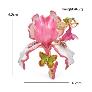 Detail of luxury enamel flower brooch featuring a fairy and butterfly, 6.2cm size