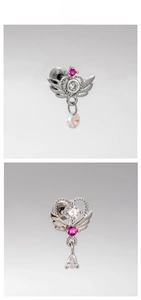 Macro shot of silver wing earring with pink cubic zirconia and screw-back detail