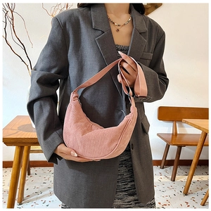 Pink corduroy dumpling bag details with adjustable wide shoulder strap for casual wear
