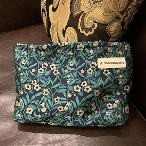 Floral jacquard travel makeup bag in deep blue with white flower and green leaf pattern