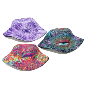 Detailed view of three bucket hats with vibrant psychedelic eye patterns and wide brims