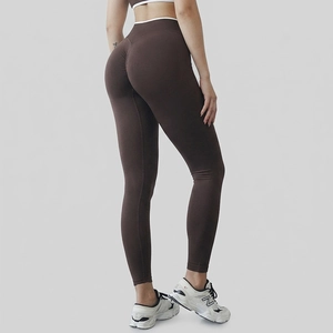 Deep brown high-waisted scrunch butt seamless yoga leggings with peach hip lifting effect