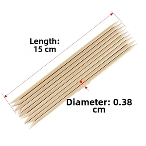 Detail view of 15cm double-tipped orange wood nail sticks with 0.38cm diameter